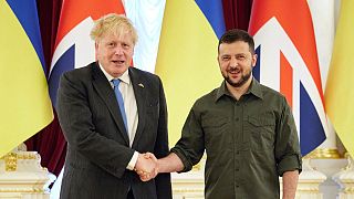 Ukrainian President Volodymyr Zelenskyy, right, and Britain's Prime Minister Boris Johnson, pose for a photo during their meeting in downtown Kyiv, Ukraine, Friday, June 17, 2