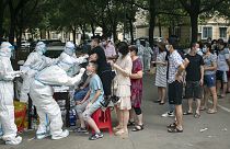 Residents line up to be tested for COVID-19 in Wuhan, 3 August 2021