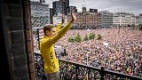 Jumbo-Visma team's Danish winner of the 109th edition of the Tour de France Jonas Vingegaard is cheered on return at Copenhagen City Hall in Copenhagen. July 27, 2022