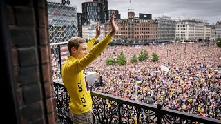 Jumbo-Visma team's Danish winner of the 109th edition of the Tour de France Jonas Vingegaard is cheered on return at Copenhagen City Hall in Copenhagen. July 27, 2022