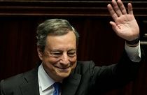 Italian Premier Mario Draghi waves to lawmakers at the end of his address at the Parliament in Rome, Thursday, July 21, 2022.