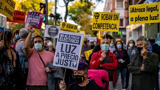 People take part in a protest against the increase of the price of electricity in Madrid, Spain, Oct. 6, 2021.