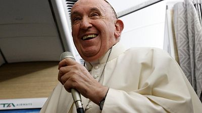 Pope Francis speaks to journalists aboard the papal flight back from Canada Saturday, July 30, 2022