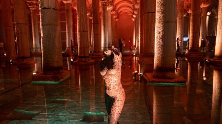 People visiting the Basilica Cistern historic site in Istanbul, Turkey, on July 26, 2022.