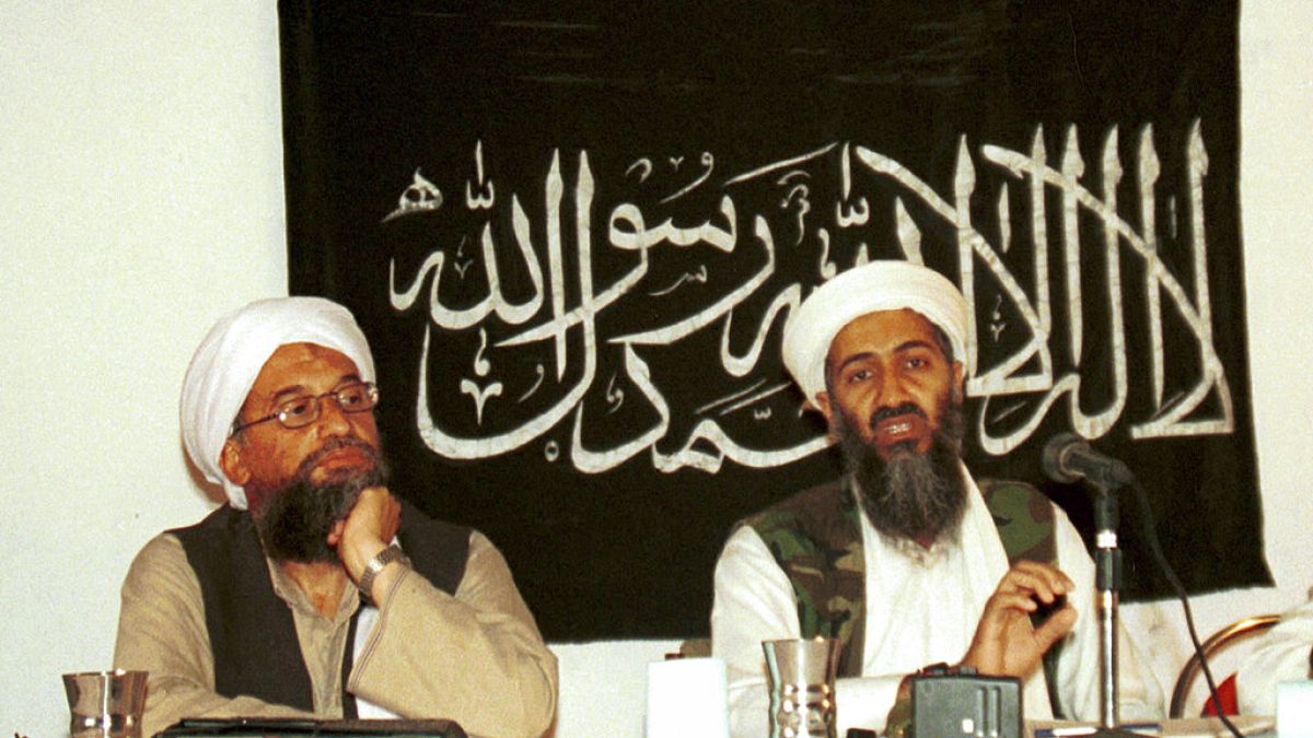 Ayman al-Zawahri, left, listens during a news conference with Osama bin Laden in Khost, Afghanistan. 
