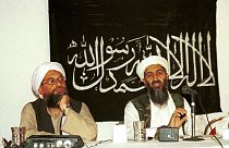 Ayman al-Zawahri, left, listens during a news conference with Osama bin Laden in Khost, Afghanistan.