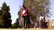 Indigenous Aymara women play golf in Bolivia