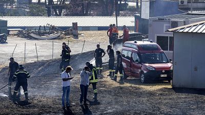 Firefighters intervene to extinguish a fire at the Cinecittà studios southeast of Rome