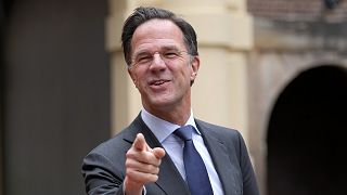 Dutch Prime Minister Mark Rutte points when joking with the media while waiting for the arrival of India's President Ram Nath Kovind in The Hague, Netherlands.