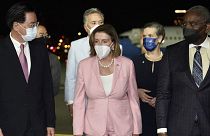 U.S. House Speaker Nancy Pelosi, center, walks with Taiwan's Foreign Minister Joseph Wu, left, as she arrives in Taipei, Taiwan, Tuesday, Aug. 2, 2022.