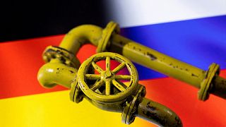 Gas pipes over a German and Russian flag.