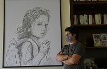 Paul Naggear, stands next a portrait of his daughter Alexandra, who was killed in 2020 massive blast at Beirut's seaport