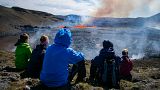 People visit the scene of the newly erupted volcano taking place in Meradalir valley, near mount Fagradalsfjall, Iceland. August 4, 2022