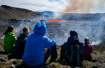 People visit the scene of the newly erupted volcano taking place in Meradalir valley, near mount Fagradalsfjall, Iceland. August 4, 2022