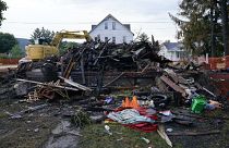 A house that was destroyed by a fatal fire is viewed in Nescopeck, Pa., Friday, Aug. 5, 2022.