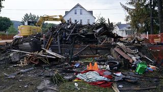 A house that was destroyed by a fatal fire is viewed in Nescopeck, Pa., Friday, Aug. 5, 2022.