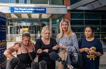 Hollie Dance, second left, surrounded by family and friends, outside the Royal London hospital following the death of her 12 year old son Archie Battersbee, August 6, 2022.