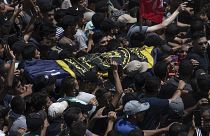 Mourners carry the body of Islamic Jihad commander Khaled Mansour during a funeral for him and others killed in Israeli airstrikes on Gaza, August 7, 2022.