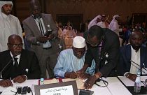 Firma del acuerdo en Doha, Catar.
