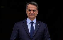 FILE - Greece's Prime Minister Kyriakos Mitsotakis stands outside Maximos Mansion in Athens, May 6, 2022. 