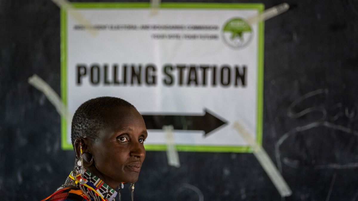 A Maasai woman waits to cast her vote at a polling station in Esonorua Primary School, in Kajiado County, Kenya Tuesday, Aug. 9, 2022.