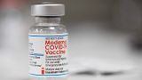 A vial of the Moderna COVID-19 vaccine is displayed on a counter at a pharmacy in Portland, Ore. on Dec. 27, 2021.