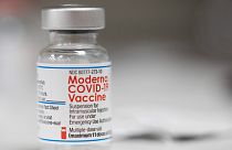 A vial of the Moderna COVID-19 vaccine is displayed on a counter at a pharmacy in Portland, Ore. on Dec. 27, 2021.