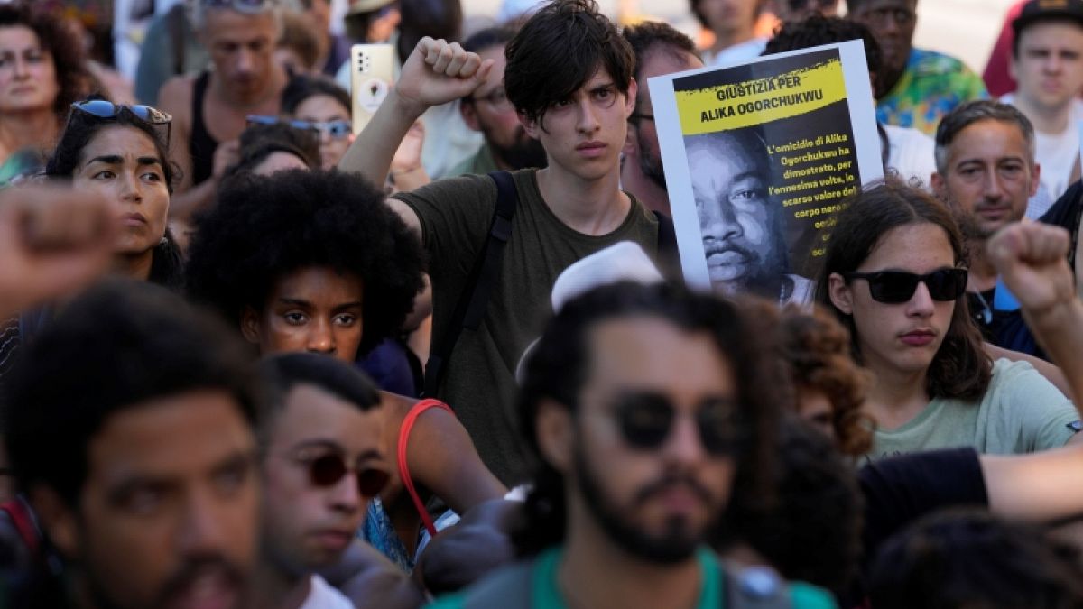 Demonstrators gather during a protest to demand justice for Nigerian street vendor Alika Ogorchukwu in Civitanova Marche, Italy. Saturday, 6 August 2022