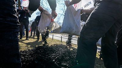 Polish coal miners attend a protest to demand Germany to stop importing Russian coal oil and gas in front of the German Embassy in Warsaw, March 24, 2022.