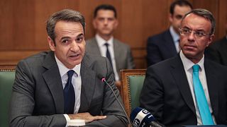 Greek Prime Ministers Kyriakos Mitsotakis, left, and Finance Minister Christos Staikouras in Athens, July 10, 2019. 