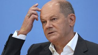 German Chancellor Olaf Scholz addresses the media during his first annual summer news conference in Berlin.