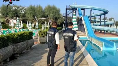 Italian police carrying out a health control in a waterpark, in a picture published by the Carabinieri police arm