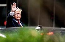 Former President Donald Trump waves as he departs Trump Tower, Wednesday, Aug. 10, 2022, in New York