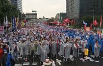 Protesto que pede ao governo sul-coreano que suspenda a política hostil em relação à Coreia do Norte e à China