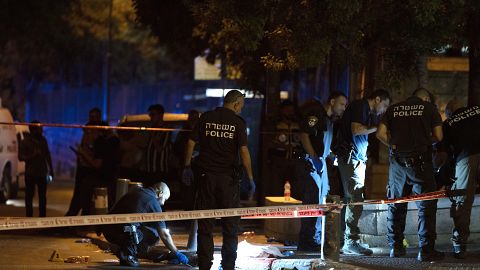 Israeli police work at the scene of the shooting near the Old City of Jerusalem, August 14, 2022.