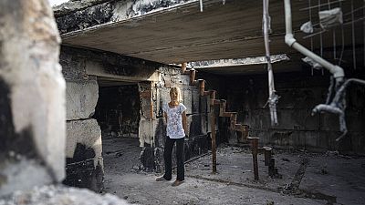 Groups of volunteers help to rebuild houses damaged in the conflict in Ukraine