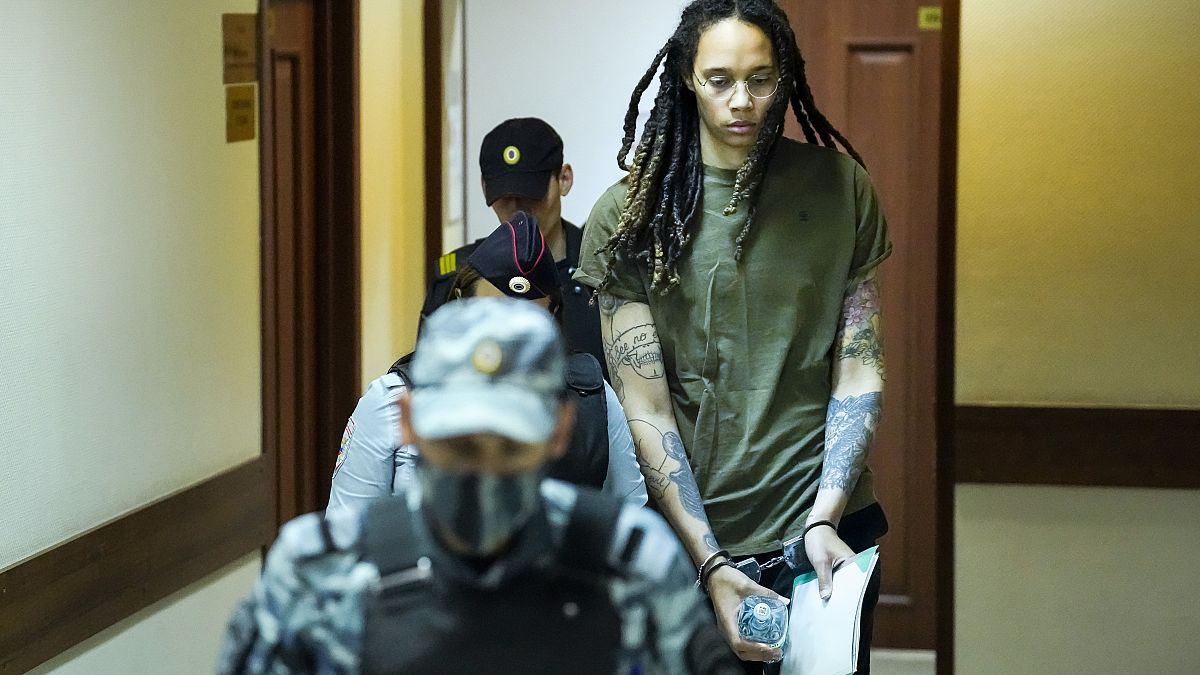 Brittney Griner is escorted to a courtroom prior to a hearing, in Khimki, Russia, 2 August, 2022. 