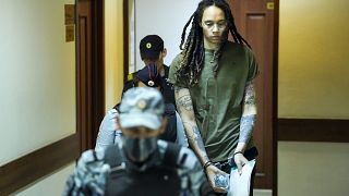 Brittney Griner is escorted to a courtroom prior to a hearing, in Khimki, Russia, 2 August, 2022.