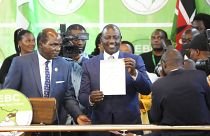 William Ruto, centre, shows a certificate after the announcement of the results of the presidential race at the Centre in Bomas, Nairobi, Kenya, Monday, Aug. 15, 2022.