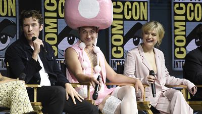 Ezra Miller, centre, dressed in a Toadette costume from the Super Mario Bros. video game franchise, attends Comic-Con International on Saturday, July 21, 2018 Ezra Miller, centre, dressed in a Toadette costume from the Super Mario Bros. video game franchise, attends Comic-Con International on Saturday, July 21, 2018