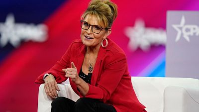FILE - Former Alaska Gov. Sarah Palin makes a joke about the size of the state of Texas compared to Alaska, 4 August 2022