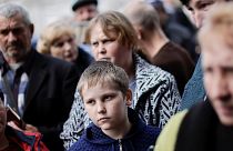 Ukrainian refugees wait to collect aid and register at a centre for internally displaced people, amid Russia's invasion of Ukraine, in the town of Kryvyi Rih