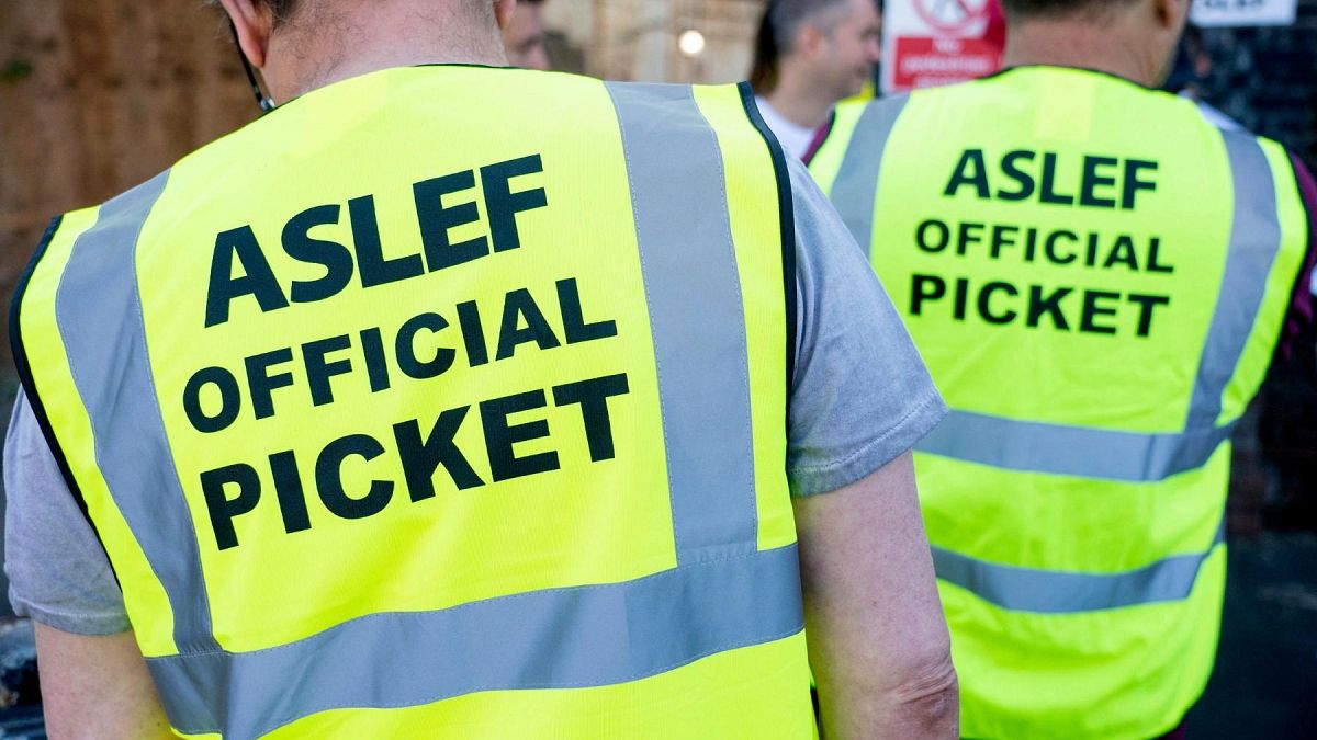Aslef, Associated Society of Locomotive Engineers and Firemen members are pictured on a picket line at Willesden Junction station, Aug. 13, 2022.
