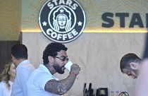 Russian singer and entrepreneur Timur Yunusov, better known as Timati, drinks coffee at a newly opened Stars Coffee coffee shop in Moscow, 18 August 2022