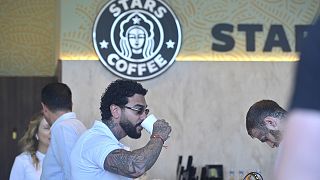 Russian singer and entrepreneur Timur Yunusov, better known as Timati, drinks coffee at a newly opened Stars Coffee coffee shop in Moscow, 18 August 2022