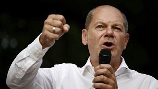 German Chancellor Olaf Scholz gestures at a dialogue event in Neuruppin, Germany, Wednesday, Aug. 17, 2022.