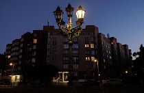 A partly glowing gas street lamp is seen at dusk in Berlin, Germany, August 11 2022.