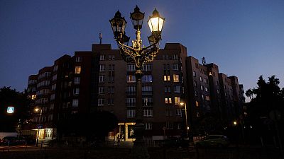A partly glowing gas street lamp is seen at dusk in Berlin, Germany, August 11 2022. A partly glowing gas street lamp is seen at dusk in Berlin, Germany, August 11 2022.