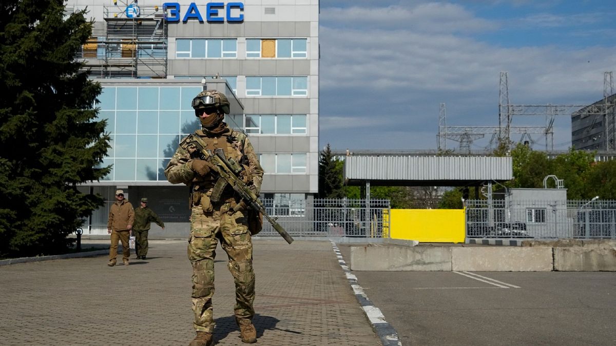 A Russian serviceman stands guard in an area of the Zaporizhzhia Nuclear Power Station in territory under Russian military control, southeastern Ukraine, on May 1, 2022