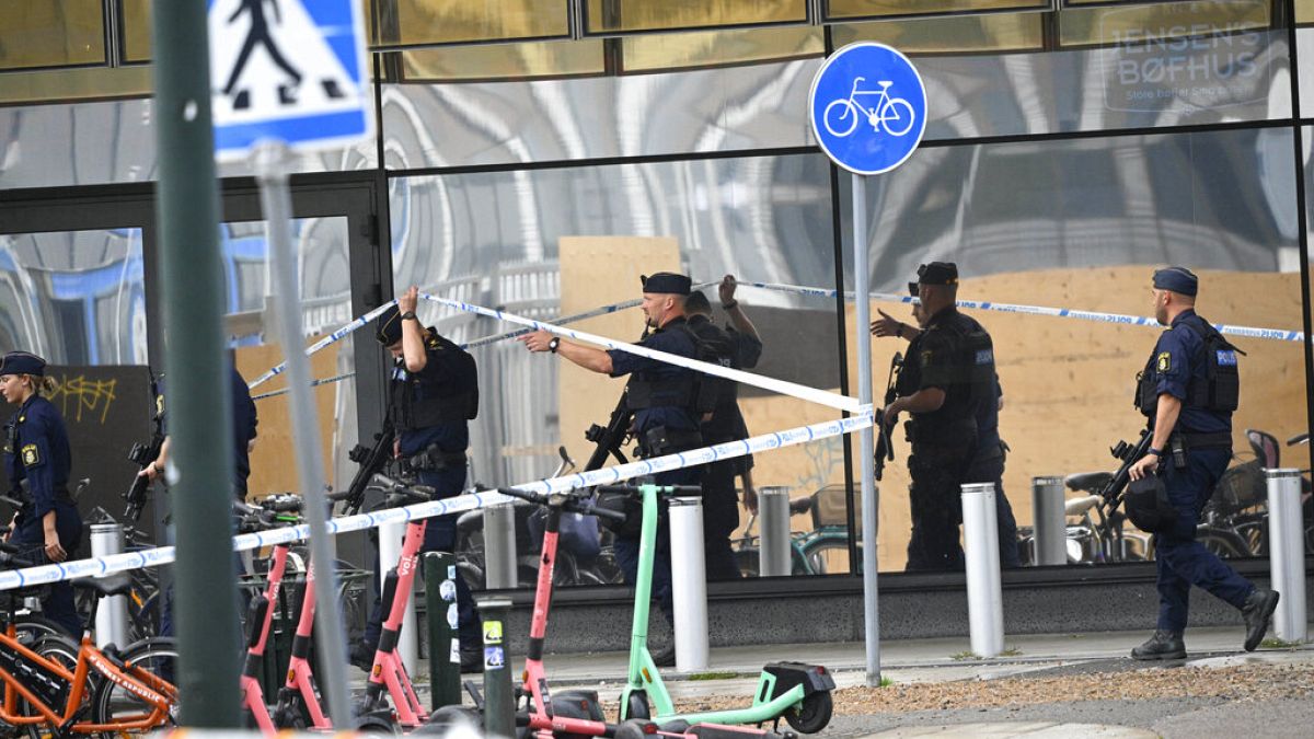 Policemen arrive at the scene of shooting at Emporia shopping centre in Malmo, Sweden, Friday, 19 Aug., 2022.